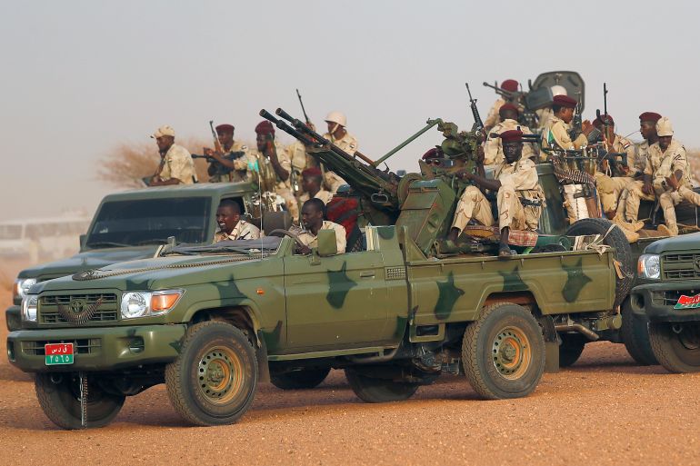 Sudanese soldiers from the Rapid Support Forces unit which led by Gen. Mohammed Hamdan Dagalo, the deputy head of the military council, secure the area where Dagalo attends a military-backed tribe's rally, in the East Nile province, Sudan, Saturday, June 22, 2019. Sudan's protest leaders say they are meeting with an Ethiopian envoy over proposals to resume negotiations with the ruling military council. (AP Photo/Hussein Malla)