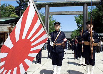 World War II veterans in Imperial Navy uniforms offer prayers for war dead at Yasukuni Shrine in Tokyo, 22 April 2003, on the annual grand festival in spring. A total of 74 Japanese lawmakers, including a state minister, made their pilgrimage to the nation's controversial war shrine, risking another round of outraged protest from neighboring countries. AFP PHOTO/Kazuhiro NOGI