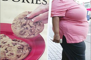 f: A woman leaves a cookie store in Los Angeles, 30 July 2003. Obesity in the United States has risen at an epidemic rate in the past 20 years, according to the Center for Disease Control (CDC). One of the national health objectives for the year 2010 is to reduce the prevalence of obesity among adults to less than 15 percent, says the CDC.