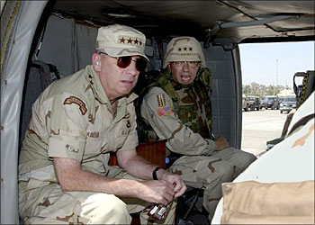 afp - This US army handout picture shows top US general for forces in the region John Abizaid (L) and Lt.