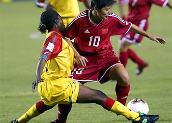 f: Ying Liu (10) from China protects the ball against Lydia Ankrah (L) from Ghana during the first half of their FIFA 2003 Woman's World Cup first round match in Carson, CA 21 September 2003.