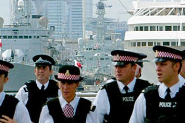 r / British police officers form a security