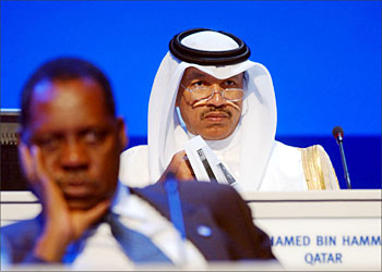 The Asian Football Confederation (AFC) President Mohammed Bin Hammam (R) listen along with the chief of the African Football Federation Issa Hayato (L) during the extraordinary congress of the Asian Football Confederation (AFC) in Doha 19 October 2003. AFP PHOTO/Fadi HAJJ