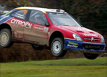 r - Great Britains Colin McRae leaves the ground during the Margam Park stage of the British Rally in south Wales, November 8, 2003