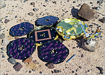 This November 2003 image shows a Beagle 2 model on the Mars simulation surface. Europe's mission to search for life on Mars cleared a vital hurdle 19 December 2003 as its unmanned orbiter ejected a probe that should land on the Red Planet on Christmas Day. "They successfully separated," the European Space Agency's director of science, David Southwood, said, in a teleconference to the agency's headquarters in Paris from mission control in Darmstadt, Germany. AFP PHOTO BEAGLE 2 PROJET - ALL RIGTHS RESERVED BEAGLE 2