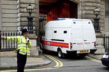 F_A police van transporting Sadji Badat (R) arrives at Bow Street magistrate court in London 04 December 2003.