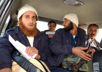 f: Jordanian prisoners in Iraq arrive 18 January 2004 at Amman airport after being freed by the US-led coalition occupying Iraq. The prisoners, most of them under 25 years of age