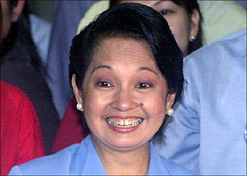 afp - Philippine President Gloria Arroyo smiles after filing her certificate of candidacy at the Commission on Election (Comelec), O5 January 2004 in Manila. Arroyo, 56, filed her re-election bid for the May 2004 polls and vowed unprecedented reforms including a shift to a parliamentary and federal form of government. AFP PHOTO/Jay DIRECTO
