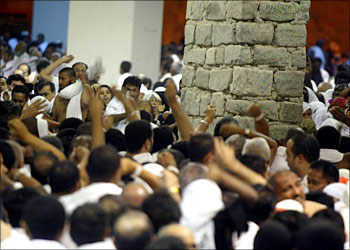 Muslim throw stones at pillars representing the 'devil' during the last stage of the annual hajj pilgrimage just before sunrise 01 February 2004, in the Mina valley, just outside the Saudi holy city of Mecca. Several people were trampled to death at the 'stoning of the devil' ritual in Mina according to the official Saudi news agency SPA. More than 1.7 million pilgrims will take part in the ritual on the first day of Eid al-Adha, or feast of sacrifice, in which faithful stone three giant concrete pillars symbolizing 'Satan'. More than 1.7 million pilgrims, including 1.41 million foreigners, gathered in the Mecca area to perform the hajj, one of the five pillars of Islam required of able-bodied Muslims at least once in their lifetime, if they can afford it.