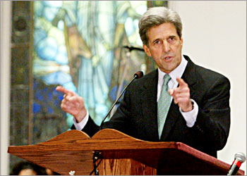 U.S. Democratic presidential candidate Senator John Kerry (D-MA) speaks to the congregation from the pulpit during Sunday services at the Greater Bethlehem Temple Apostolic Faith Church in Jackson, Mississippi March 7, 2004. Kerry is campaigning in Mississippi while continuing his quest for the Democratic presidential nomination before voters go to the polls in Mississippi, Louisiana, Texas and Florida on March 9. REUTERS/Jim Bourg US ELECTION