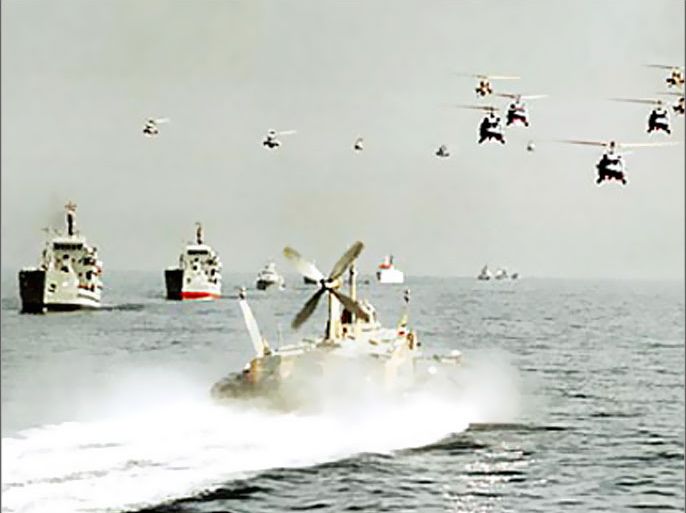 f: File pictures dated 29 October 2000 shows Iranian army helicopters and Navy boats taking part in maneuvers in the Strait of Hormuz. The Iranian navy has seized three British naval boats alleged to have entered its territorial waters on the Iraqi border