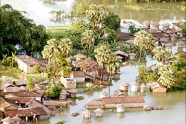r - An aerial view shows submerged houses in the flood hit area of Khagaria village, in the eastern Indian state of Bihar July 23, 2004