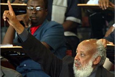 f: A members of the new Somali parliament raises his hands to object the proceeding of the new parliament during the inaugural session 02 September 2004 in Nairobi.
