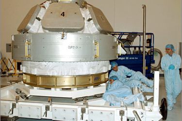 AFPThis NASA image from 08 October, 2004 shows workers at the Space Station Processing Facility, checking the Cupola, the final element of the Space Station core,