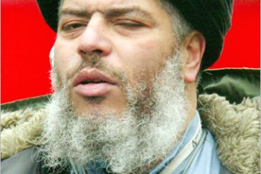 REUTERS - Muslim cleric Sheikh Abu Hamza al-Masri leads prayers outside North London Central Mosque in Finsbury Park,