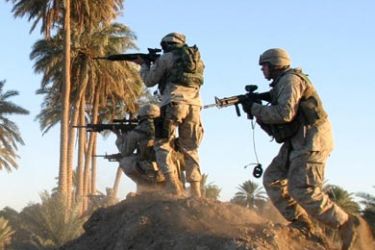 r/U.S. Marines open fire on insurgent positions during a series of raids hunting arms and guerrilla suspects south of Baghdad December 1, 2004