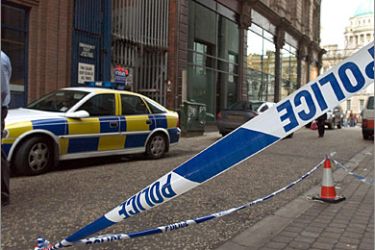 AFP /A police line tapes off the side of the Northern Bank main branch on Wellington Street in Belfast