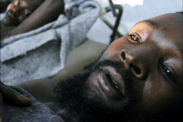 f_Burundian men infected by cholera lay in an MSF (Doctors Without Borders) center in Bujumbura, Burundi