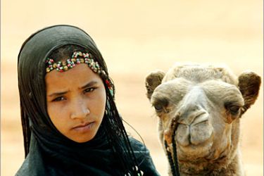 AFP / A young nomad holds a camel during the "moussem" (festival) of Tan Tan in the southern town of Guerrara in southern Morocco, 17 September 2005. The festivities