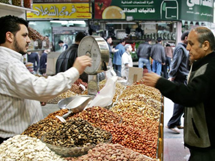 AFP / A Syrian man sells roasted nuts at a shop in downtown Damascus, 31 October 2005. The Security Council was due to meet today afternoon to decide on a resolution urging