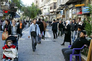 . AFP / Syrians walk through the streets of Old Damascus, 31 October 2005. The Security Council was due to meet today afternoon to decide on a resolution urging Damascus to