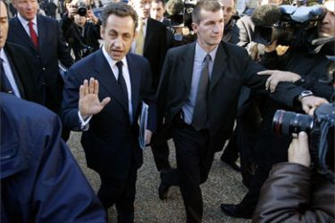 French Interior Minister Nicolas Sarkozy (2nd L) speaks to journalists as he leaves the Elysee Palace after attending an extraordinary cabinet meeting 08 November 2005 in Paris. The French government today approved giving curfew powers to regional authorities to stem urban violence that has raged for 12 nights, Interior Minister Nicolas Sarkozy said after a cabinet meeting.