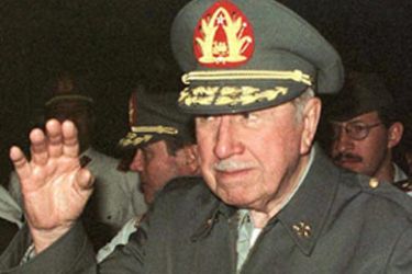 f_Chilean General Agusto Pinochet waves as he arrives at a military base in Salinas, Ecuador 27