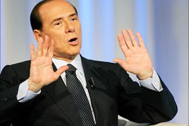 f_Italian Prime Minister Silvio Berlusconi answers to journalist Bruno Vespa during the broadcast "Porta a porta