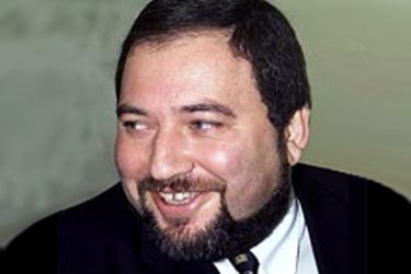 This combo picture shows Avigdor Lieberman (R) in a 03 January 1999 filer taken in Tel Aviv when he announced the formation of a new political party for Russian immigrants,