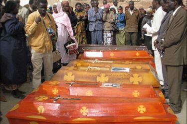 afp - Sudanese refugeeS in Egypt gather 13 March 2006 around seven caskets belonging to some of the 27 Sudanese killed when Egyptian police broke up a protest