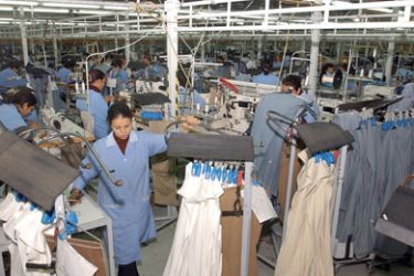 Women sew clothes in a Tunis textile factory 15 March 2006. Textile sector yields 50 percent of Tunisian export.