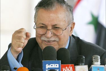r_Iraqi President Jalal Talabani talks to the media after presiding over a meeting of all religious and political