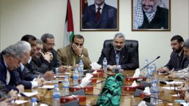 Palestinian Prime Minister Ismail Haniyeh (C) meets with senior leaders of the Palestinian faction at his office in Gaza April 16, 2006.