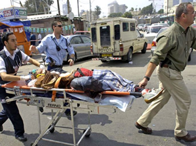 afp/An injured person is wheeled away from the site of a suicide attack in the southern Neveh Sha'anan district, close to the site of Tel Aviv's old bus station,17 April 2006. Six people were killed and dozens wounded in Israel's commercial capital Tel Aviv today when a Palestinian militant blew himself up in the deadliest suicide bombing of the last 20 months. AFP PHOTO/NIR KAFRI-ISRAEL OUT-MAGS OUT