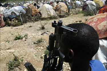 f_A Somali gunman watches over an IDP camp in Wajid, Somalia, 01 May 2006 as the new United Nations