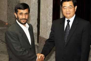 Iranian President Mahmoud Ahmadinejad (L) meets with Chinese President Hu Jintao before their bilateral meeting at the Xijiao State Guest House in Shanghai, 16 June 2006. Ahmadinejad in China to attend the Shanghai Cooperation Organization summit, said 16 June the international incentive offer to curtail his nation's nuclear program was a "step forward" that would be carefully considered.