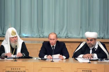 afp/Russian President Vladimir Putin (C) delivers a speech, as Chairman of the Supreme Religious Council of Peoples of the Caucasus, Spiritual head of Muslims of Azerbaijan Sheikh-ul-Islam Allakhshukiur Pasha-zade (R) and the Patriarch of Moscow and All Russia Alexy II (L) listen to him at the opening ceremony of the World Summit of Religious Leaders in Moscow, 03 July 2006