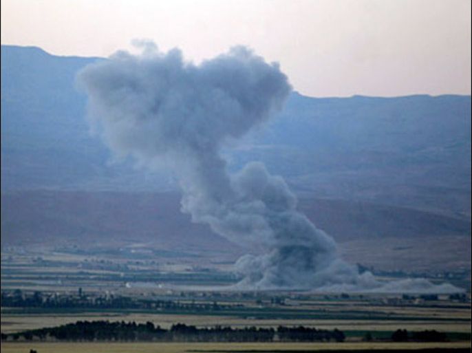 Smoke rises 23 July 2006 from an Israeli air stike on the village of Nabi Sheet near the eastern city of Baalbek in the Bekaa valley
