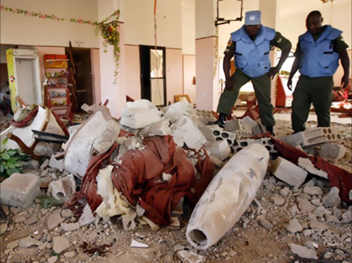 AFP/Ghanaian peacekeepers with the United Nations Interim Forces in Lebanon (UNIFIL) check an unexploded bomb dropped by an Israeli warplane on a restaurant near the southern Lebanese village of Ain Ebel, 28 August 2006.