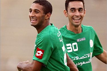 AFP / Moroccan soccer player Khaled al-Suweihli (L) of Saudi Arabia's Al-Ittifaq club celebrates with his Brazilian teammate Julio Cezar after scoring against Oman's Al-Nasr club during