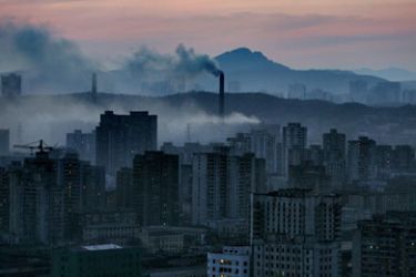 "Swiss bank targets top companies' impact on climate change" (FILES) A view of the North Korean capital Pyongyang shows heavy pollution from coal powered power plants, 24 March 2005. Investors can now find out