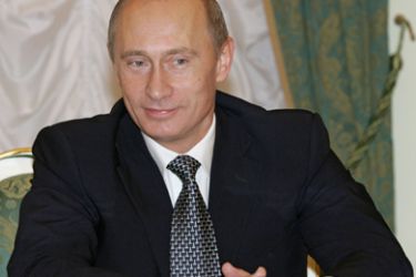 AFP/Russian President Vladimir Putin smiles during his meeting with Israeli Prime Minister Ehud Olmert in the Kremlin in Moscow, 18 October 2006.