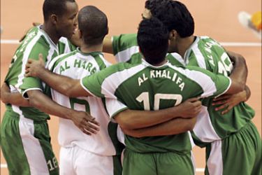 r_Saudi Arabia players celebrate their win over Macau during the men's team tournament qualifications Pool B volleyball match at the Al-Rayyan Indoor Hall during the 15th Asian Games in Doha November 26, 2006. REUTERS/Fadi Alassaad (QATAR)
