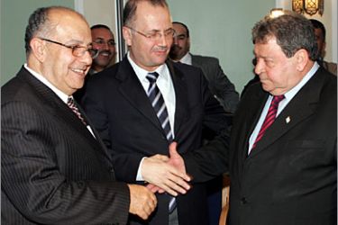AFP/Israeli Infrastructure Minister Benjamin Ben Eliezer (R) shakes hands with Palestinian Authority economic adviser Mohammed Mustafa as Jordanian Water Minister Zafer al-Aalem (L) looks on after a press confrence in the Dead Sea resort of Shuneh 10 December 2006. Jordan, Israel and the Palestinian Authority launched a feasibility study to help save the rapidly vanishing Dead Sea
