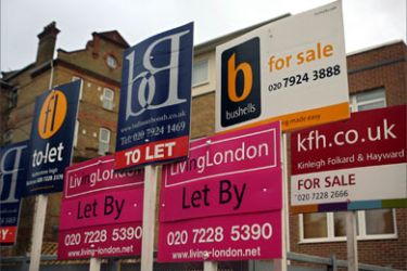 Estate agent sign boards are pictured in south-west London, 11 January 2007, on the day the Bank of England surprised homeowners and financial experts by raising the interest rate by 0.25 per cent to 5.25 per cent. In reaction, sterling shot above 1.95 dollars, but London's FTSE 100 leading shares index fell after the rate increase to a level last seen in July 2001.
