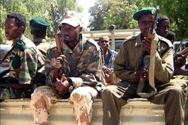 f_Somali Transitional Government troops patrol Mogadishu 31 January 2007 in the government officials' district after a night of heavy mortar shelling aimed at Ethiopian positions