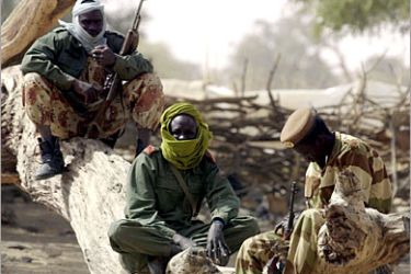EPA/ Chadian soldiers in no-mans-land between the border of Chad and Sudan, just outside Tine, Tuesday, January 27, 2004. Since March over 100,000 people have fled into Chad