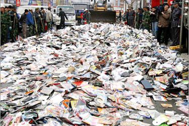 REUTERS/ Officials and labourers prepare to destroy pirated CDs and DVDs in Shenyang, capital of northeast China's Liaoning province, April 14, 2007. The European Union should try to