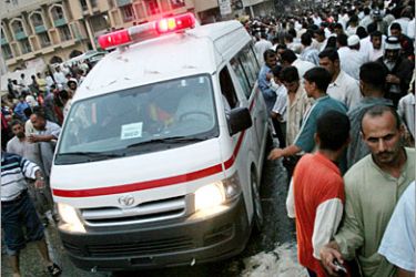 AFP / An ambulance rushes to the site of a suicide car bomb in the holy city of Karbala, central Iraq, 28 April 2007. A suicide car bomb attack near a revered Shiite shrine in the central Iraqi