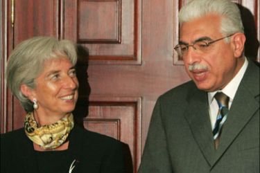 afp - French Trade Minister Christine Lagarde (L) and Egyptian Prime Minister Ahmed Nazif (R) talk during the signing of a cooperation treaty between